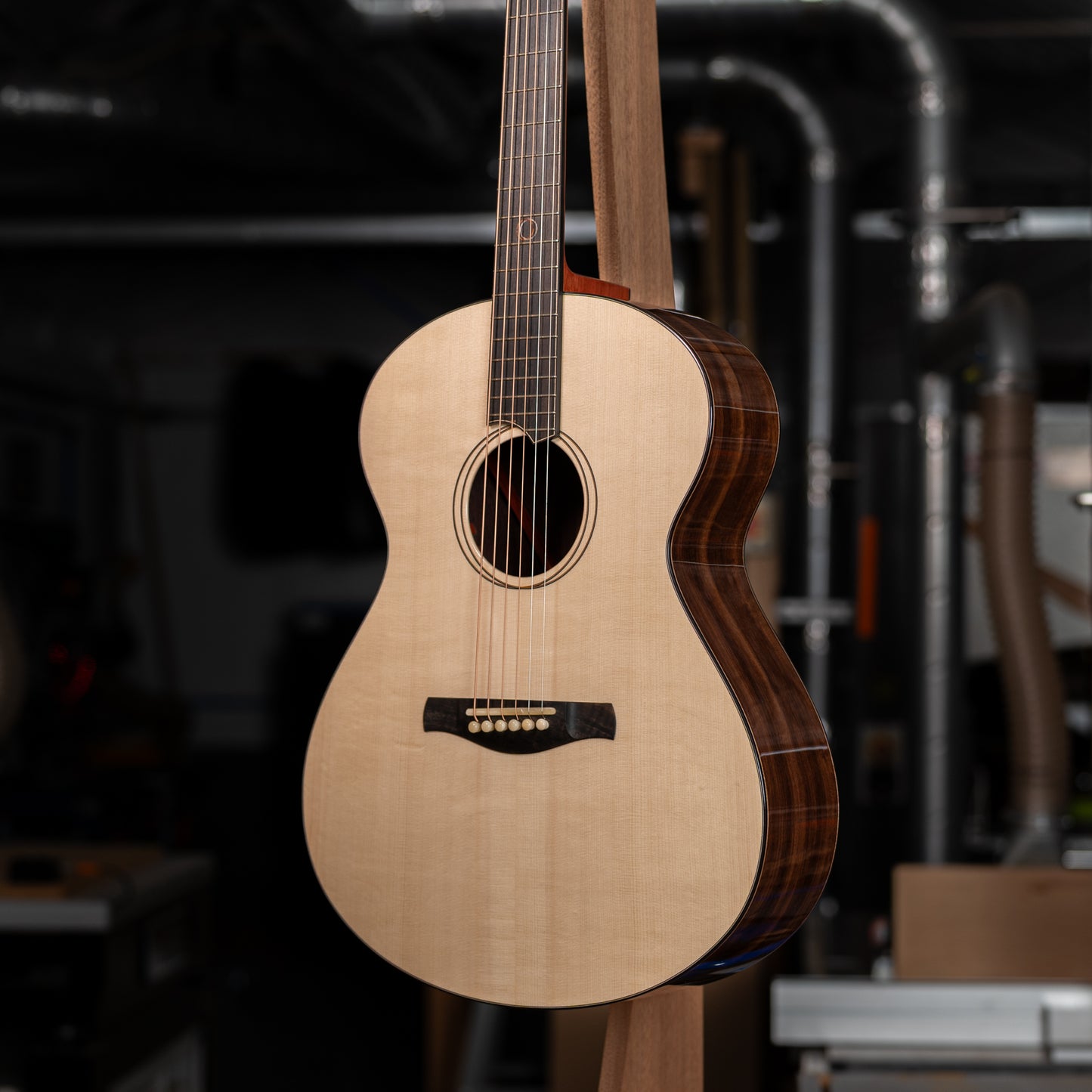 Close-up of a guitar body from the front at a slight sideways angle.